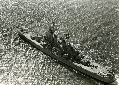 Aerial shot of a battle ship sailing through the sea