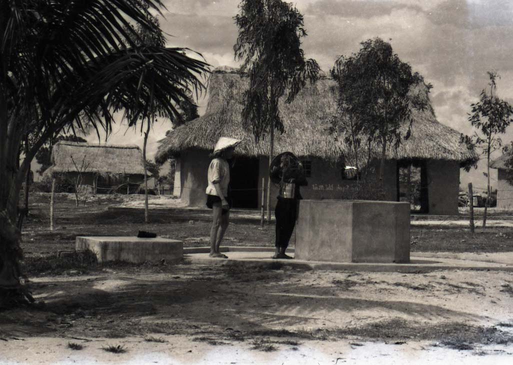 Villagers at a well, approximately 1962-1968